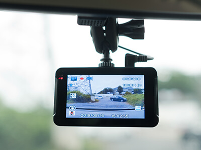 An image of a dashcam inside a car
