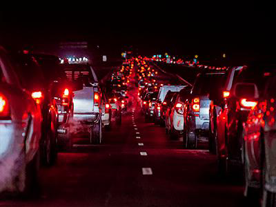 Cars backed up in traffic in the dark