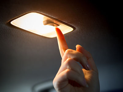 person turning off in car light
