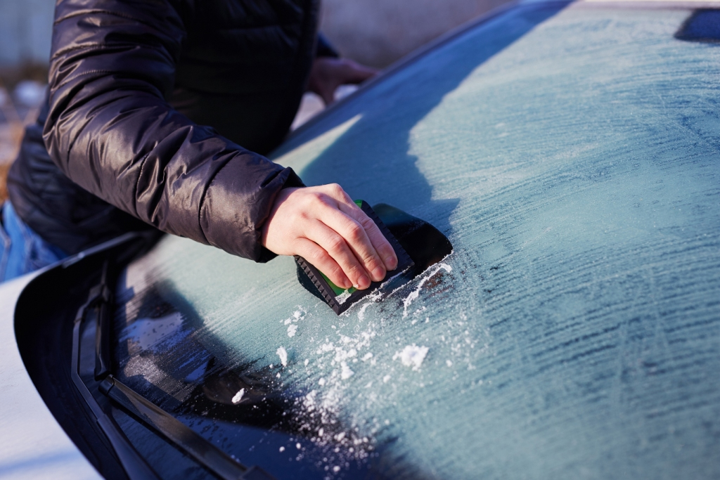 car windscreen being scraped